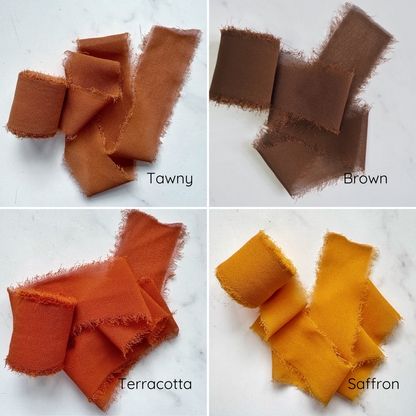 An assortment of chiffon ribbons in various colors displayed on a light background.